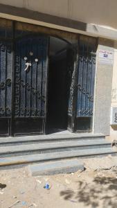 an entrance to a building with a pair of shoes on the door at الغردقة الدهار القيادات in Hurghada