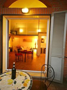 a room with a table and a dining room at Sinfonia Bellini - Central 2-Room-Flat in Verbania
