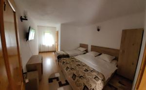 Llit o llits en una habitació de Casa Ursului 49 fotos més