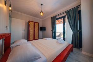 a bedroom with two beds and a large window at Sapanca Göldibi Suit Bungalov in Sakarya +258 photos