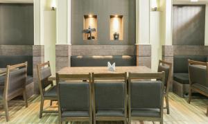 a dining room with a table and chairs at Treebo Bliss in Jaipur