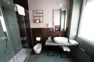 a bathroom with a sink and a shower at Bed In Centro in Naples