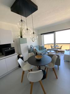 a kitchen and living room with a table and chairs at Malibu Beach 9C in Blankenberge