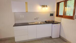 Virtuve vai virtuves zona naktsmītnē Apartamentos Don Gerardo