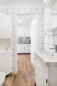 Kuchyňa alebo kuchynka v ubytovaní Happy Stay Tartaczna Residence I + 37 fotografií