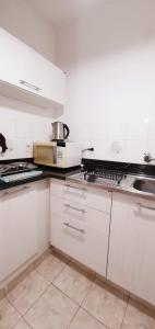 Virtuve vai virtuves zona naktsmītnē Apartamentos Don Gerardo