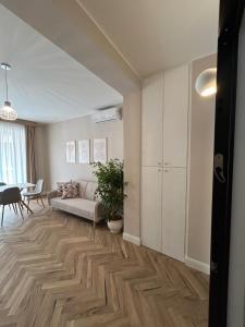 a living room with a couch and a table at VACA - Vico Anna Carafa Apartments in Fondi