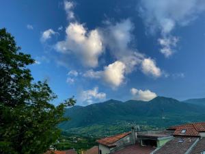 a view of mountains and a blue sky with clouds at Dimora Nuscana in Nusco