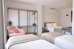 Postel nebo postele na pokoji v ubytování Anchor Alaçatı Hotel