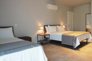 Postel nebo postele na pokoji v ubytování Anchor Alaçatı Hotel