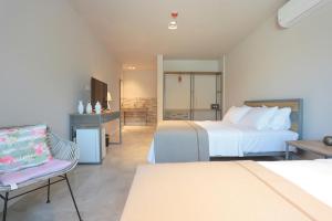 Postel nebo postele na pokoji v ubytování Anchor Alaçatı Hotel + 37 fotografií