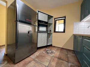 a kitchen with a stainless steel refrigerator at Villa Alessandra in Emona