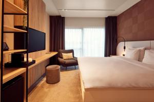 Cama ou camas em um quarto em Van der Valk Hotel Gent
