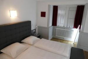 Ein Bett oder Betten in einem Zimmer der Unterkunft Hotel Ottheinrich