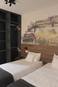 Katil atau katil-katil dalam bilik di Tvrdjava Rooms - Novi Sad