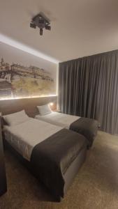 Katil atau katil-katil dalam bilik di Tvrdjava Rooms - Novi Sad