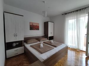 Katil atau katil-katil dalam bilik di Apartmani Katarina&Ivan Krstinić