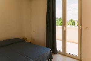 Postel nebo postele na pokoji v ubytování Villa del Ponente Otranto