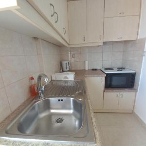Kuchyň nebo kuchyňský kout v ubytování Central Rooms