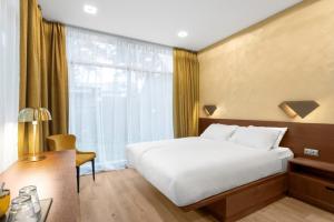 Postel nebo postele na pokoji v ubytování Rixwell Collection Seaside Hotel Jurmala