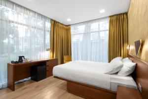 Postel nebo postele na pokoji v ubytování Rixwell Collection Seaside Hotel Jurmala
