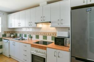 Kuchyň nebo kuchyňský kout v ubytování Increíble apartamento