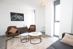 a living room with a couch and chairs and a table at High Point 1 Bedroom Apartment in Bradford