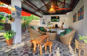 a patio with chairs and a table and a bar at Casa EspIliNorte in San Juan +16 photos
