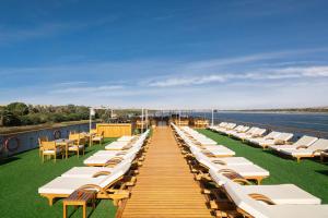 a row of lounge chairs on the deck of a cruise ship at Nile Capital Cruise - Every Monday from Luxor or Friday from Aswan in Luxor
