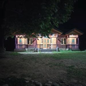 a house at night with a bench in front of it at Grand View Resorts Chatpal in Anantnāg
