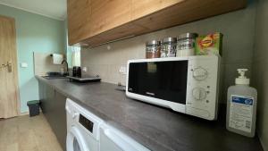 Kuchyň nebo kuchyňský kout v ubytování Apartament U Waldka