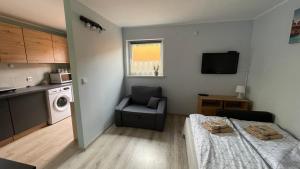 Kuchyň nebo kuchyňský kout v ubytování Apartament U Waldka