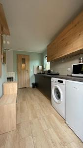 Kuchyň nebo kuchyňský kout v ubytování Apartament U Waldka
