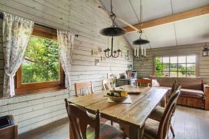 a dining room with a wooden table and chairs at Hof Keppel, der stromlose Urlaub in Schmallenberg +61 photos