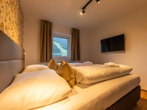 Postel nebo postele na pokoji v ubytování NEW! Tevini Alpine Apartments by we rent