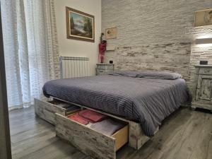 Un pat sau paturi într-o cameră la La Dolce Corte