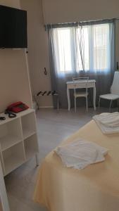 Кровать или кровати в номере Piccolo hotel holiday center