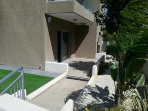 a building with a stairway leading to a house at Potamos Apartment in Limassol