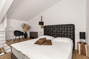 Postel nebo postele na pokoji v ubytování Hotel Harmonija SPA & FREE PARKING