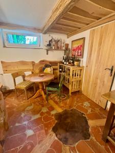 a room with a table and chairs and a window at Apartment BellArt with Sauna in Radovljica
