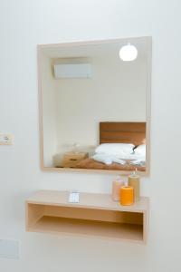 Postel nebo postele na pokoji v ubytování Urban Escape Guesthouse