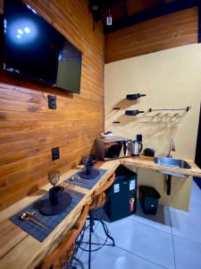 TV a/nebo společenská místnost v ubytování Cabanas Flor de Goiaba + 11 fotografií