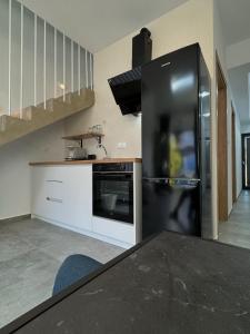 Kuchyň nebo kuchyňský kout v ubytování Zoha Villas