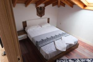 a bedroom with a bed in a room at Your charming sea view penthouse in Çeşme in Cesme