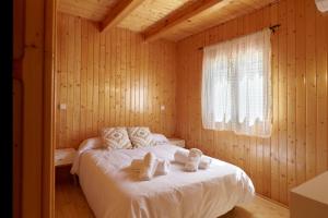 Ένα ή περισσότερα κρεβάτια σε δωμάτιο στο Casa de madera El Vado