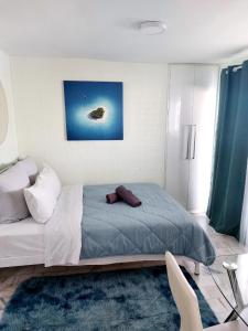 a bedroom with a large bed in a room at Athens Centre Acropolis "Loft" apartment #516 in Athens