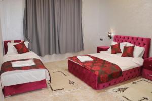 Letto o letti in una camera di Hôtel AL QAISAR