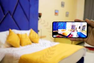 Letto o letti in una camera di Hôtel AL QAISAR