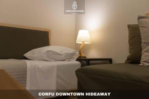 Postel nebo postele na pokoji v ubytování Corfu Downtown Hideaway