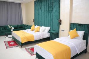 Letto o letti in una camera di Hôtel AL QAISAR